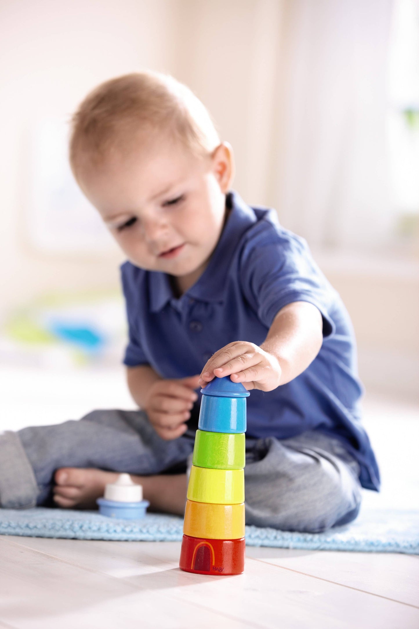 HABA USA - Wooden Rainbow Lighthouse – Montessori Stacker & Balance Toy